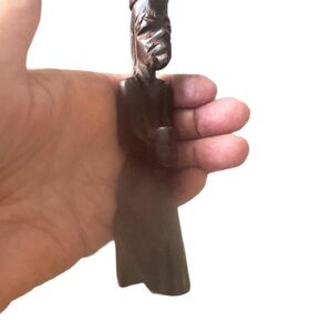 Intricately carved wooden sculpture.
Old African Art sculpture